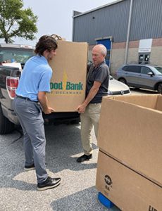 Aidan and Doug offloading food to the FBD 